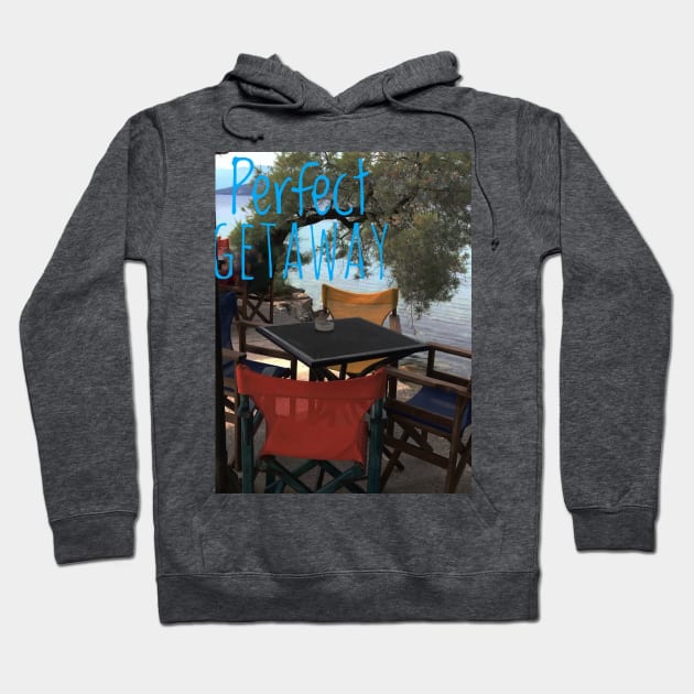 At a cafe on Mediterranean sea with text Perfect Getaway Hoodie by Khala